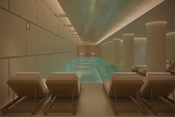 The long pool at the Surrenne spa features white pillars and wooden lounging chairs beside the pool