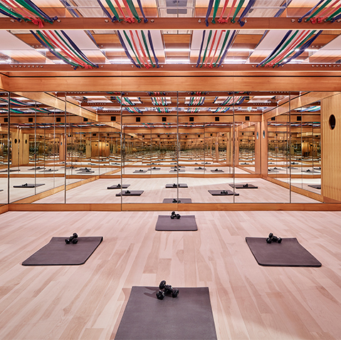 Tracey Anderson Space with floor to ceiling mirrors and resistance bands lining the ceiling